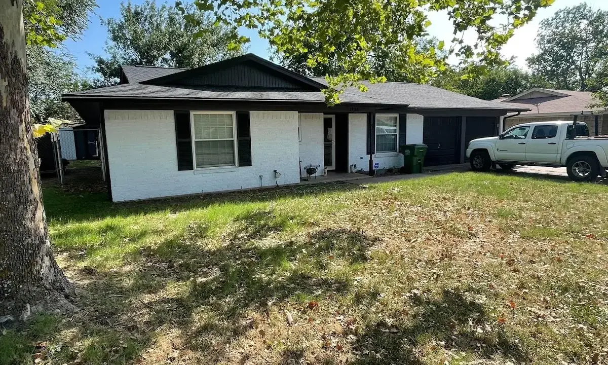 Professional roofing crew working on a residential roof in Rapid City